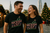 A man and a woman are standing close together, laughing while wearing matching black t-shirts with colorful text 