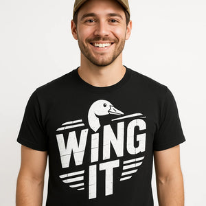 Close-up of the "Wing It" white print on a premium Bella+Canvas black geese t shirt