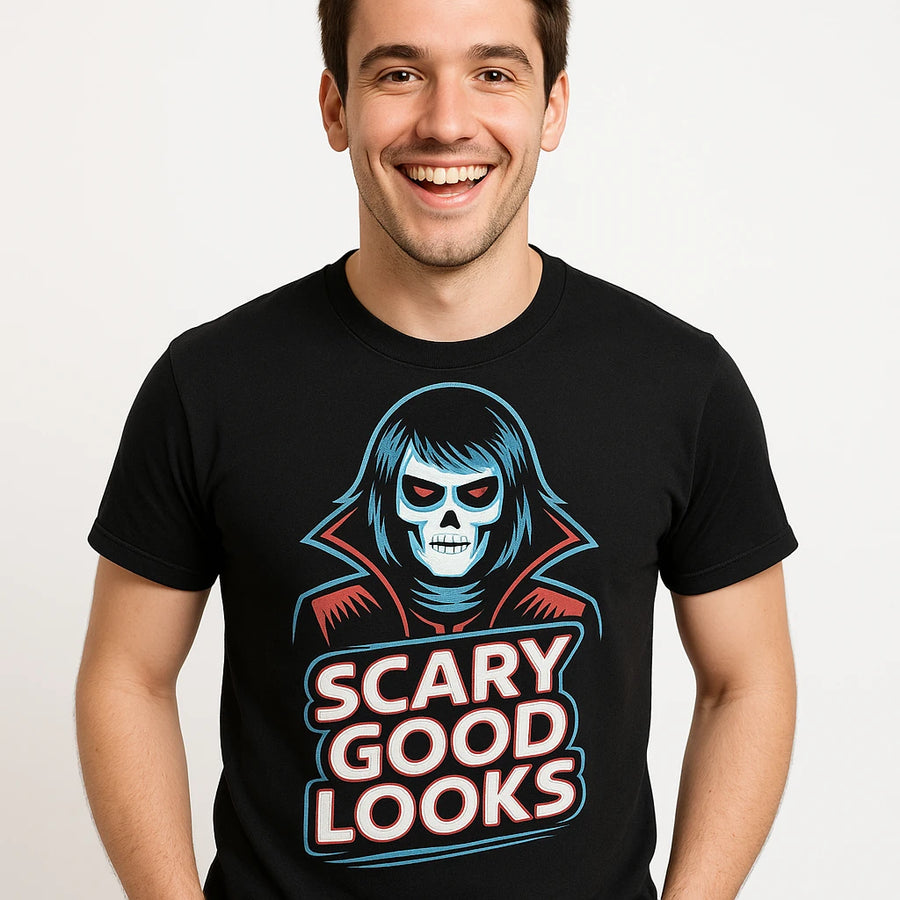 A person is smiling and wearing a black T-shirt with a graphic of a stylized, skeletal figure and the text "SCARY GOOD LOOKS" in bold, red and white letters.