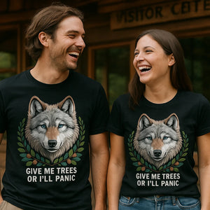 Person wearing the black forest green t shirt graphic tee - "Give Me Trees Or I'Ll Panic" design