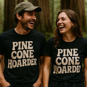 Person wearing the black nature walk shirts graphic tee - "Pine Cone Hoarder" design
