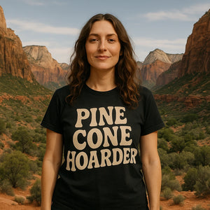 Lifestyle shot of the "Pine Cone Hoarder" black nature walk shirts in a real-world setting