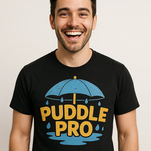 Close-up of the "Puddle Pro" teal print on a premium Bella+Canvas black rain forest shirts