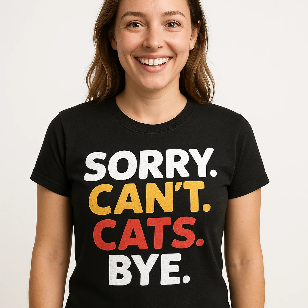 Close-up of the "Sorry. Cant. Cats. Bye." orange print on a premium Bella+Canvas black funny t shirts for cat lovers