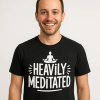 A smiling person wearing a black T-shirt with the text 