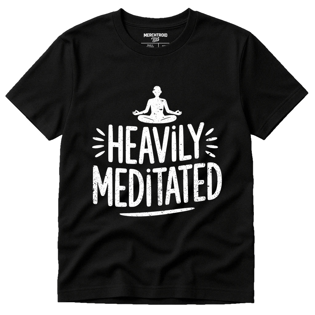 A black t-shirt with a graphic design featuring a person in a meditative pose above the text "Heavily Meditated" in white, bold, distressed letters. The shirt has a casual, relaxed style suitable for everyday wear.