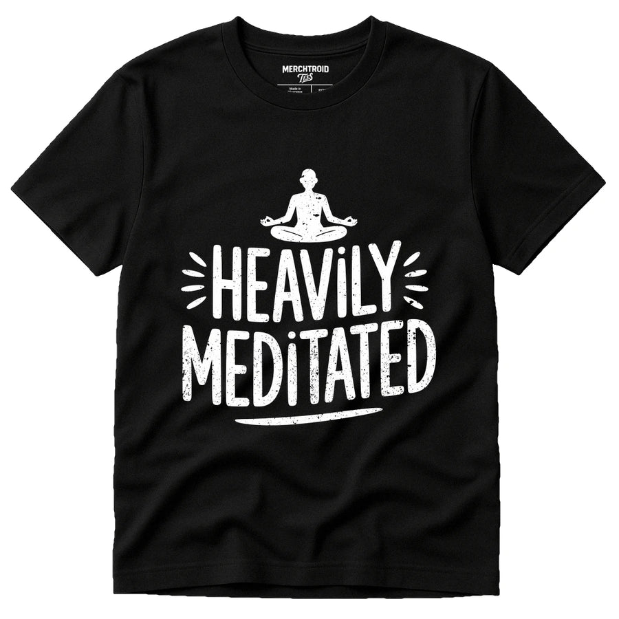 A black t-shirt with a graphic design featuring a person in a meditative pose above the text "Heavily Meditated" in white, bold, distressed letters. The shirt has a casual, relaxed style suitable for everyday wear.