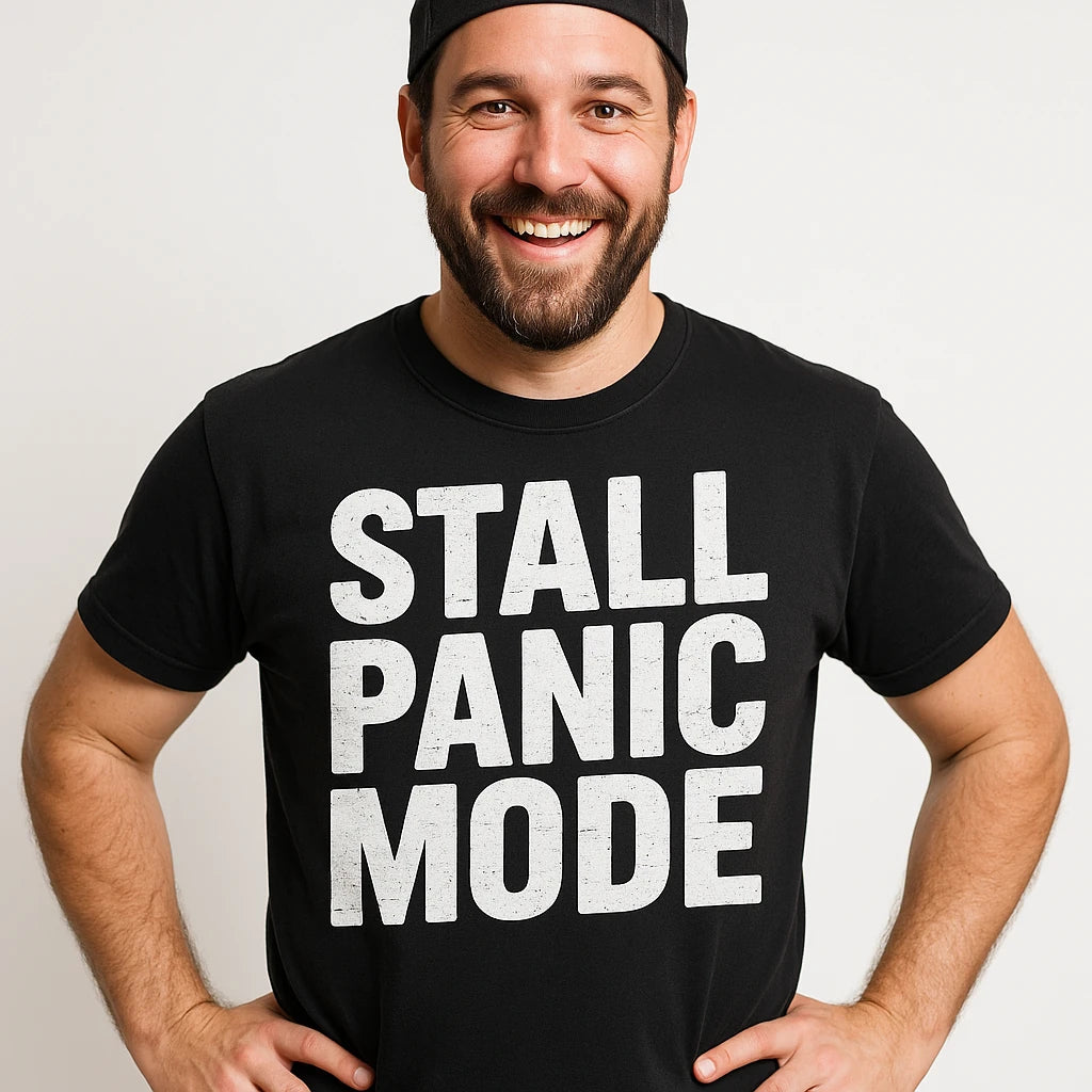 Close-up of the "Stall Panic Mode" white print on a premium Bella+Canvas black bbq tee