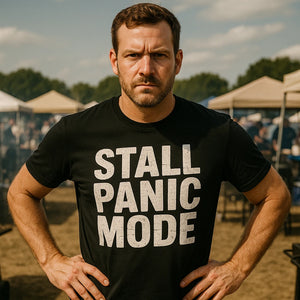 Lifestyle shot of the "Stall Panic Mode" black bbq tee in a real-world setting