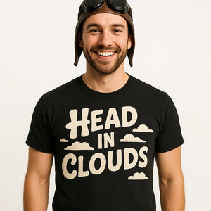 Close-up of the "Head in Clouds" beige print on a premium Bella+Canvas black flying fish t shirt