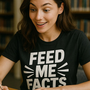 "Feed Me Facts" black studying t shirt, photographed as studying lover gift