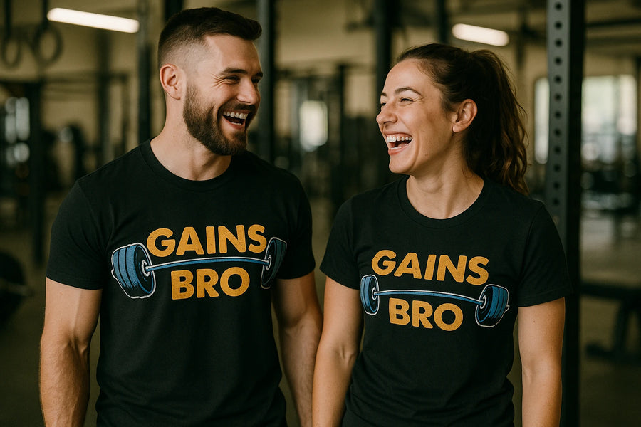 Two people inside a gym, both laughing and wearing matching black t-shirts with the text "GAINS BRO" and a graphic of a barbell. They appear to be enjoying each other's company.