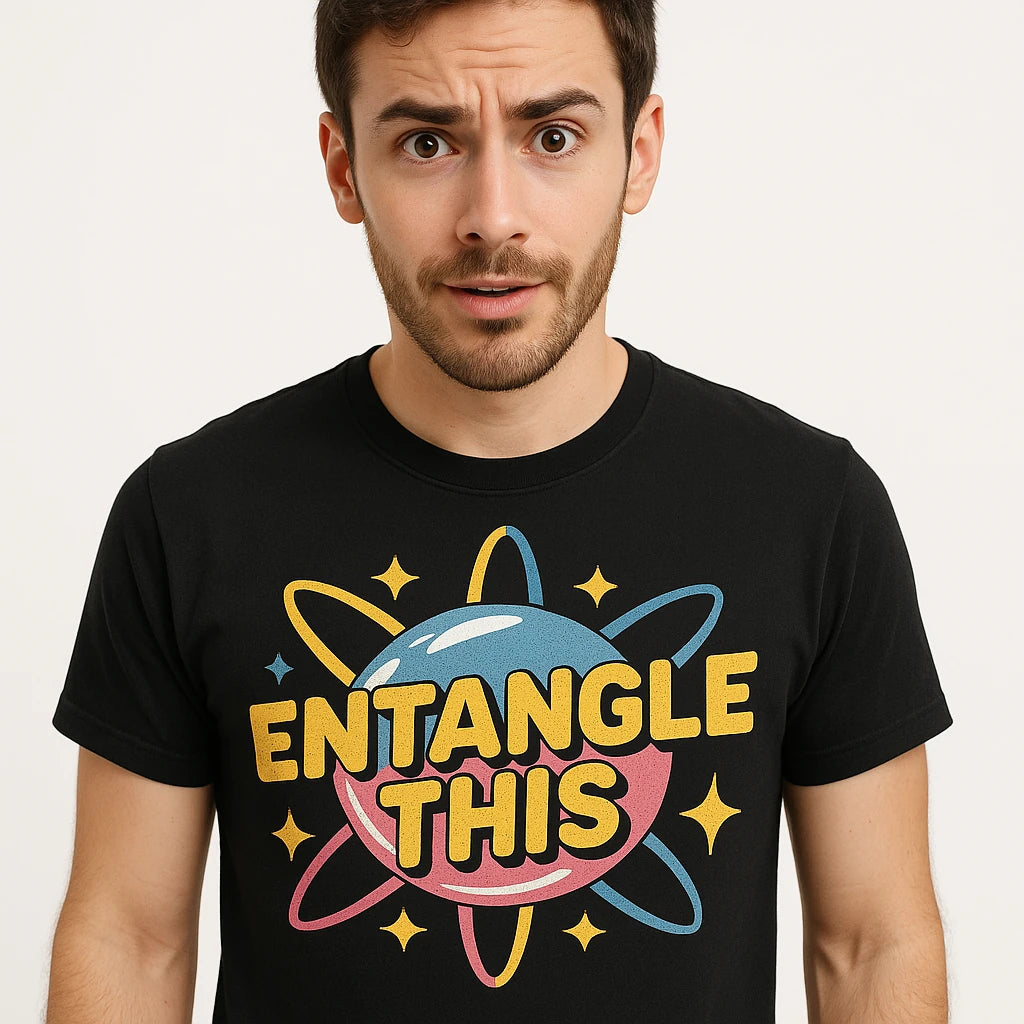 Close-up of the "Entangle This" yellow print on a premium Bella+Canvas black quantum mechanics t shirt