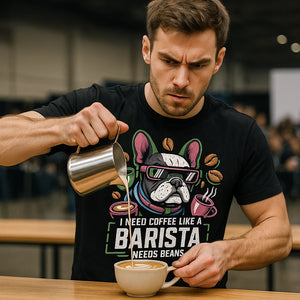 Lifestyle shot of the "I Need Coffee Like a Barista Needs Beans" black barista shirts in a real-world setting