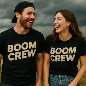 Person wearing the black storms t shirt graphic tee - "Boom Crew" design