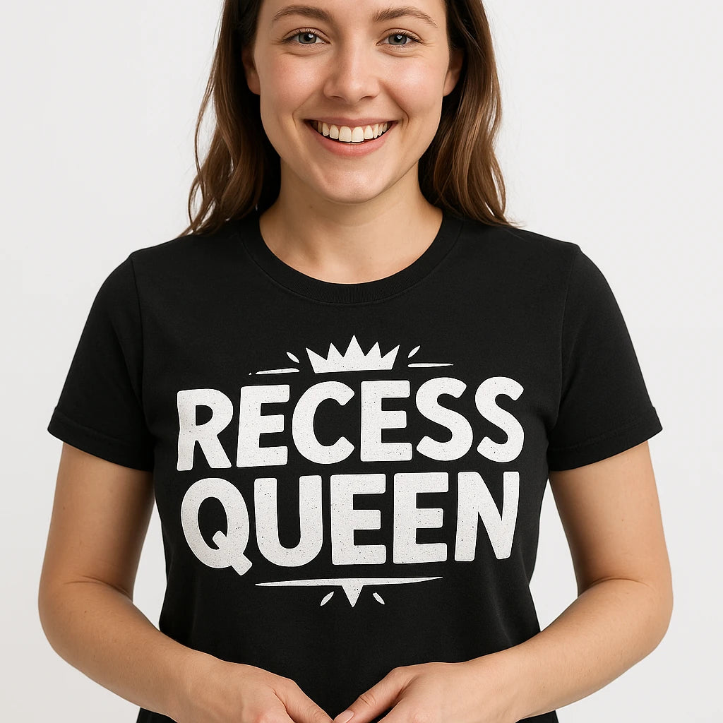 Close-up of the "Recess Queen" white print on a premium Bella+Canvas black teacher shirts