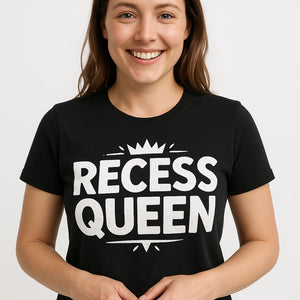 Close-up of the "Recess Queen" white print on a premium Bella+Canvas black teacher shirts