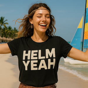 Lifestyle shot of the "Helm Yeah" black sailboat t shirt in a real-world setting