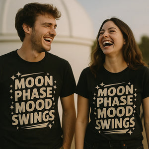 Person wearing the black stargazing t shirt graphic tee - "Moon Phase Mood Swings" design