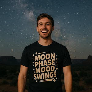Lifestyle shot of the "Moon Phase Mood Swings" black stargazing t shirt in a real-world setting