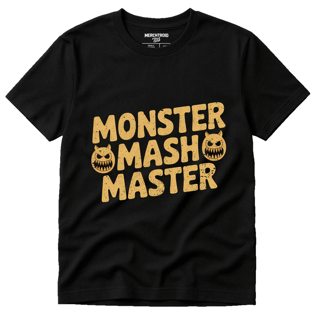 A black T-shirt with bold, yellow text that reads "MONSTER MASH MASTER" accompanied by two stylized monster faces. The shirt has a label at the neck with the brand "MERCHTROID."