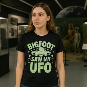 Lifestyle shot of the "Bigfoot Saw My UFO" black alien tee shirts in a real-world setting