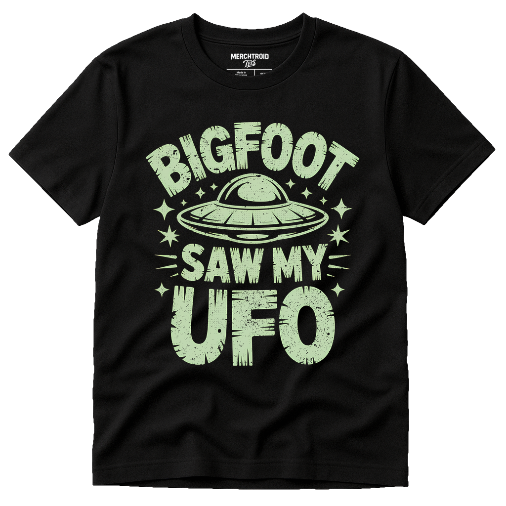 Black Alien Tee Shirts - "Bigfoot Saw My UFO" graphic tee with light gray print, flat lay product photo