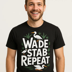 Close-up of the "Wade Stab Repeat" white print on a premium Bella+Canvas black egrets t shirt