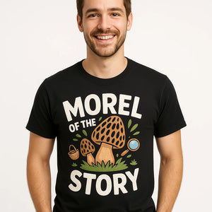 Close-up of the "Morel of the Story" white print on a premium Bella+Canvas black foraging t shirt