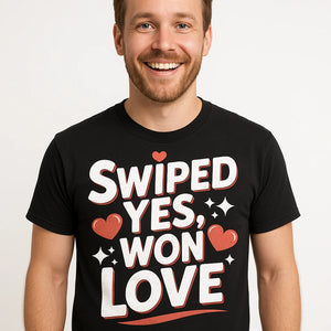 Close-up of the "Swiped Yes, Won Love" white print on a premium Bella+Canvas black relationships shirts