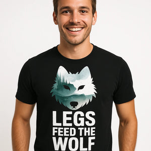 Close-up of the "Legs Feed the Wolf" white print on a premium Bella+Canvas black bike shirts mens