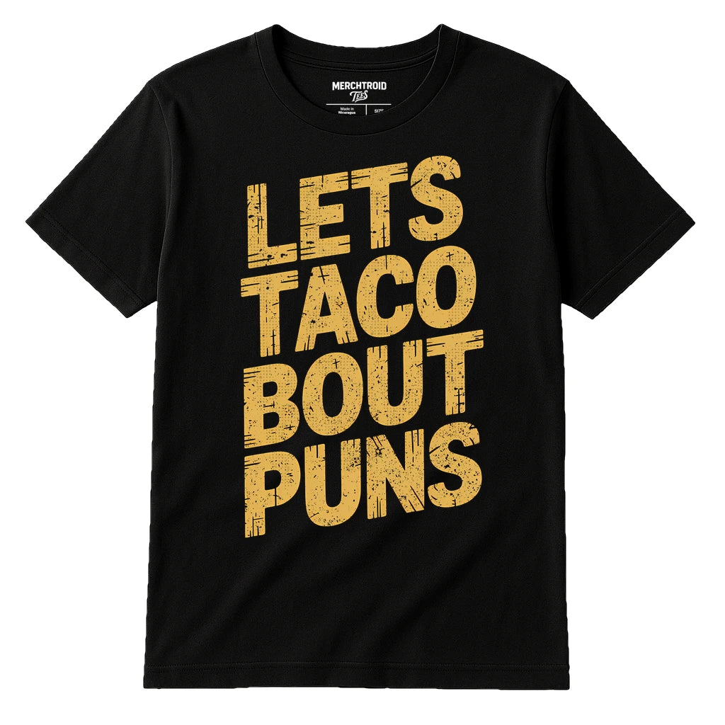 Black Comedy Tshirts - "Lets Taco Bout Puns" graphic tee with gold print, flat lay product photo