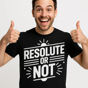 Close-up of the "Resolute Or Not" white print on a premium Bella+Canvas black mens new years eve shirts