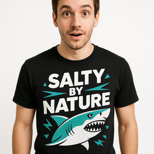 Close-up of the "Salty By Nature" white print on a premium Bella+Canvas black marine biology t shirt
