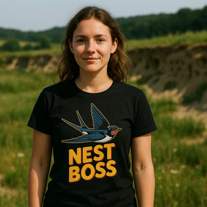 Lifestyle shot of the "Nest Boss" black swallow t shirt in a real-world setting