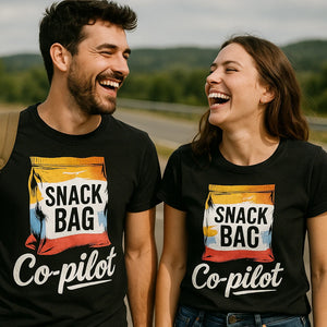 Person wearing the black road trip t shirt graphic tee - "Snack Bag Copilot" design