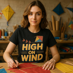 Lifestyle shot of the "High on Wind" black kite flying t shirt in a real-world setting