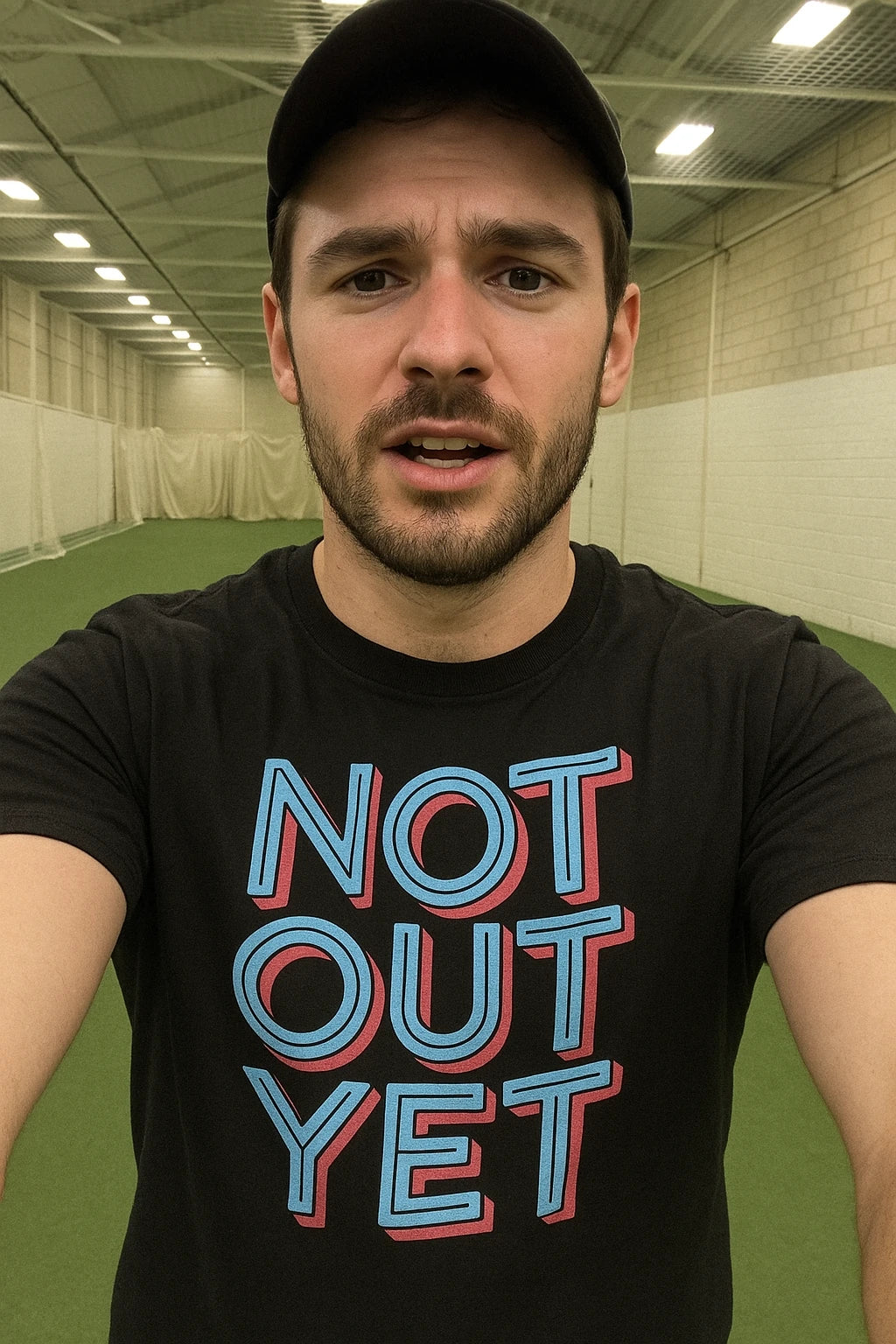"Not Out Yet" black cricket shirts, photographed as presents for cricket lovers