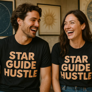 Person wearing the black astrology shirts graphic tee - "Star Guide Hustle" design