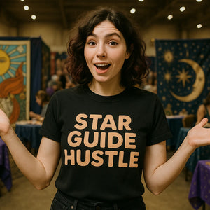 Lifestyle shot of the "Star Guide Hustle" black astrology shirts in a real-world setting