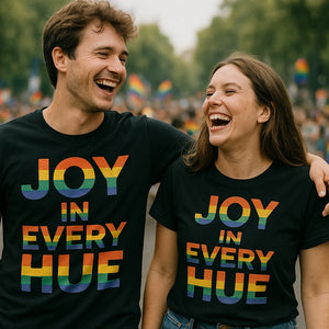 Person wearing the black t shirt lgbtq graphic tee - "Joy in Every Hue" design