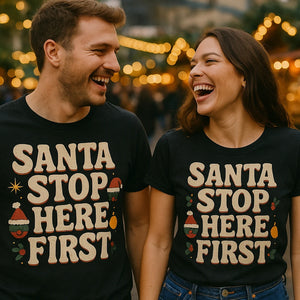 Person wearing the black christmas tee shirts for family graphic tee - "Santa Stop Here First" design