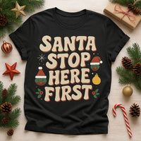 A black t-shirt with festive lettering that says 
