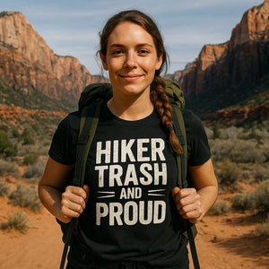 Lifestyle shot of the "Hiker Trash and Proud" black best backpacking shirts in a real-world setting