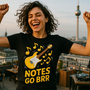 Lifestyle shot of the "Notes Go Brr" black musician graphic tees in a real-world setting