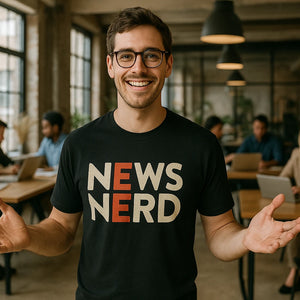Lifestyle shot of the "News Nerd" black journalist t shirt in a real-world setting