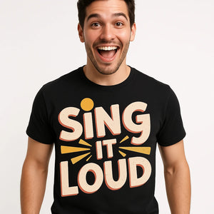 Close-up of the "Sing It Loud" cream print on a premium Bella+Canvas black singing t shirt