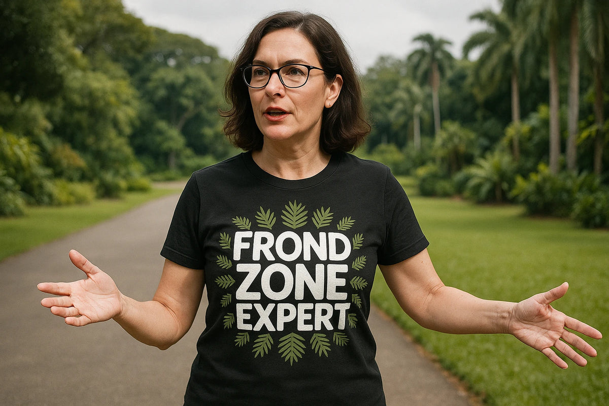 Lifestyle shot of the "Frond Zone Expert" black botany t shirt in a real-world setting