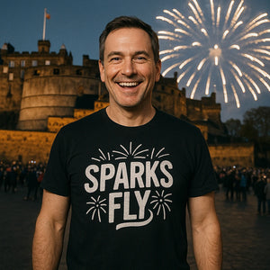 Lifestyle shot of the "Sparks Fly" black new years t shirt in a real-world setting