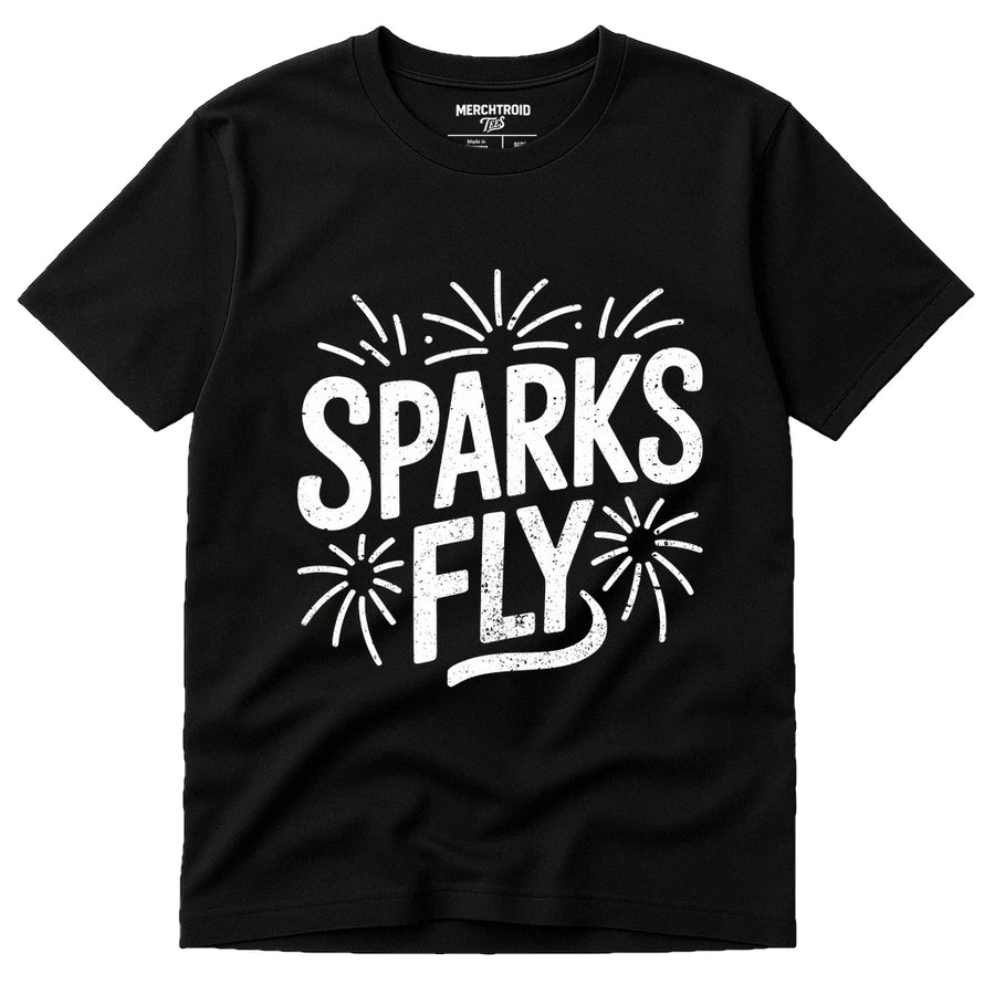 A black T-shirt with the text "SPARKS FLY" in bold white letters, surrounded by graphic illustrations of small fireworks.